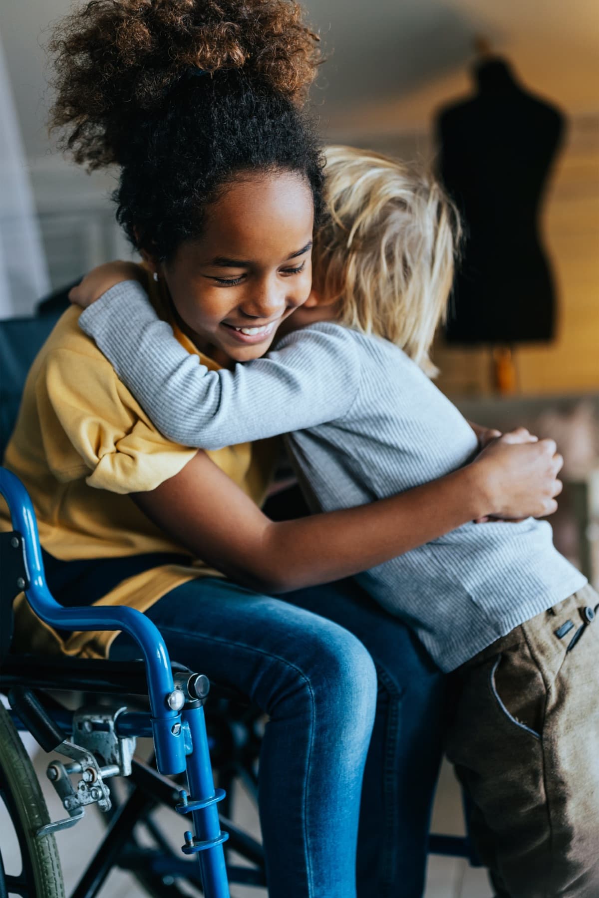 Children embracing — a symbol of our commitment to inclusion